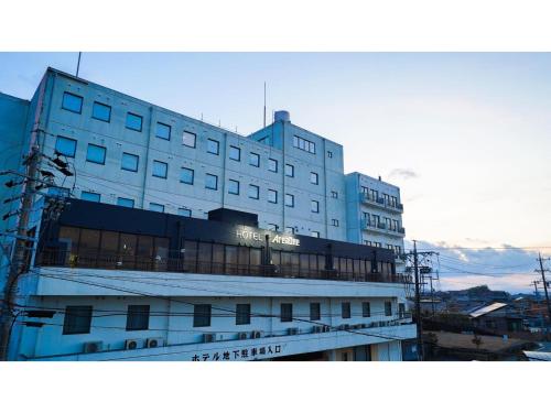a large white building with a sign on it at Hotel Area One Ise Inter - Vacation STAY 38525v in Ise