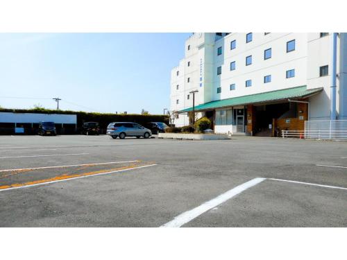 a parking lot in front of a large building at Hotel Area One Ise Inter - Vacation STAY 38525v in Ise