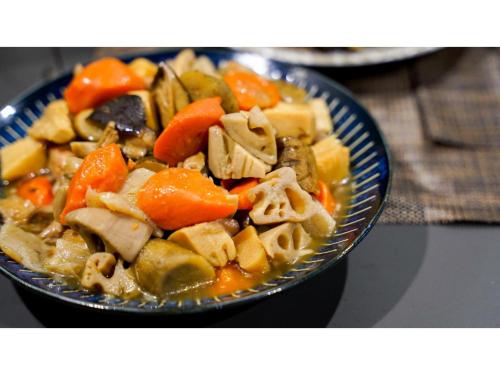 a bowl of pasta with carrots and other vegetables at Hotel Area One Ise Inter - Vacation STAY 38481v in Ise
