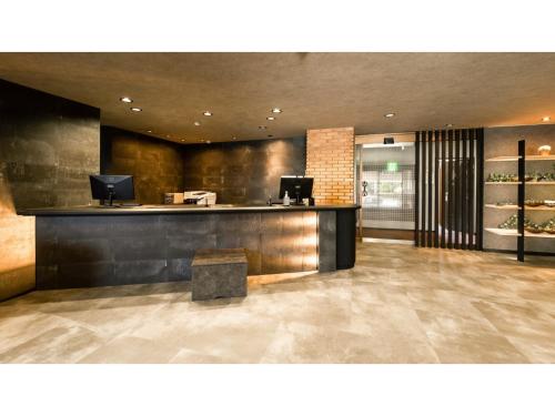 a lobby of a restaurant with a counter with at Hotel Area One Ise Inter - Vacation STAY 38481v in Ise