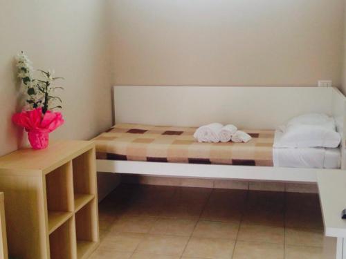 Letto o letti in una camera di Affittacamere Italia Leonardo
