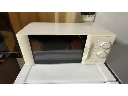 a white microwave oven with its door open at TAMA HOTEL - Vacation STAY 41338v in Ishinomaki