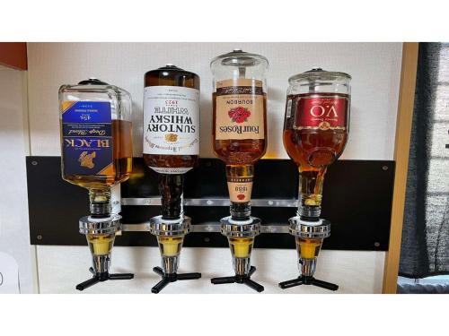 four different types of beer glasses on a shelf at TAMA HOTEL - Vacation STAY 41338v in Ishinomaki