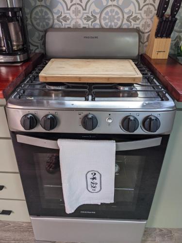 a stove in a kitchen with a towel on it at Brand New! Black Sand Beach-Casa NoSe' in Vieques
