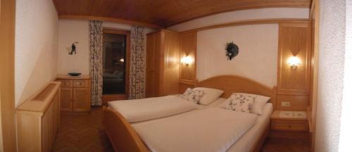 מיטה או מיטות בחדר ב-Gästehaus Gapp