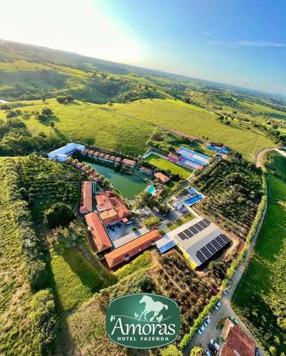 an aerial view of anolis property with a lake at Amoras Hotel fazenda in Santo Antônio de Jesus