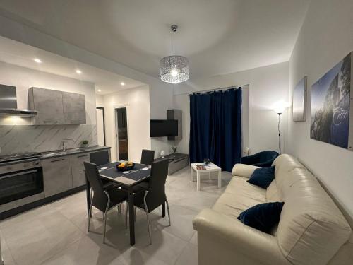 a living room with a couch and a table at Blu Eracleo in Trapani
