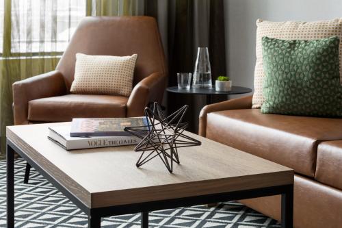 a living room with a couch and a coffee table at The Arcadian in Brookline