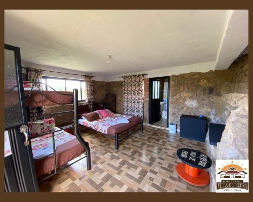 Postel nebo postele na pokoji v ubytování Hospedaje Villa de piedra