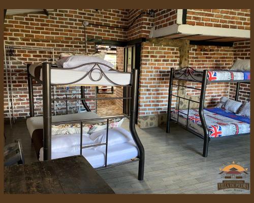 Postel nebo postele na pokoji v ubytování Hospedaje Villa de piedra