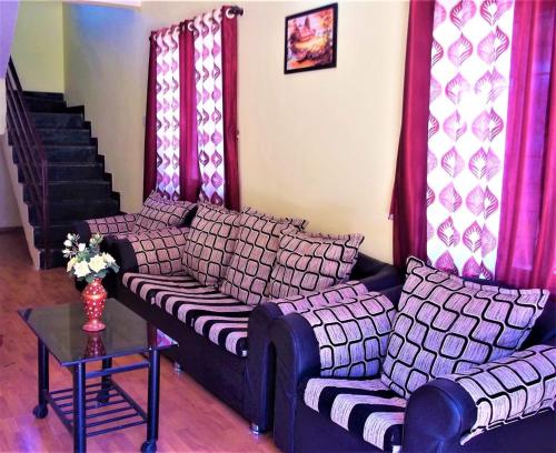 Coin salon dans l'établissement Divine Villas