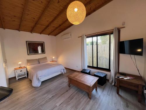 Ένα ή περισσότερα κρεβάτια σε δωμάτιο στο Los Bungalows