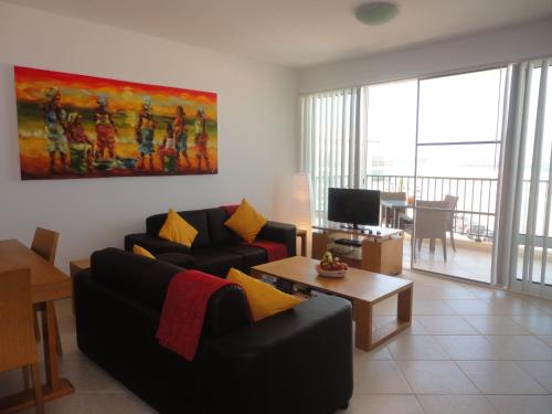 a living room with a couch and a table at Vila Cabral 2 Apartments in Sal Rei