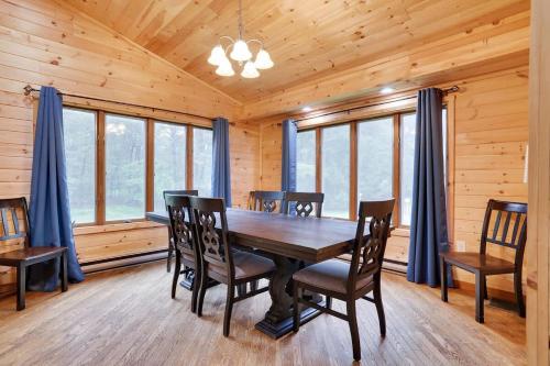a dining room with a wooden table and chairs at Relax in Blakeslee - Spacious 5BR Home with BBQ in Blakeslee