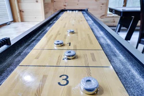 a bowling alley with three balls on the lanes at Relax in Blakeslee - Spacious 5BR Home with BBQ in Blakeslee