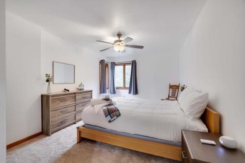 a bedroom with a bed and a ceiling fan at Relax in Blakeslee - Spacious 5BR Home with BBQ in Blakeslee