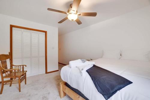 a bedroom with a bed and a ceiling fan at Relax in Blakeslee - Spacious 5BR Home with BBQ in Blakeslee
