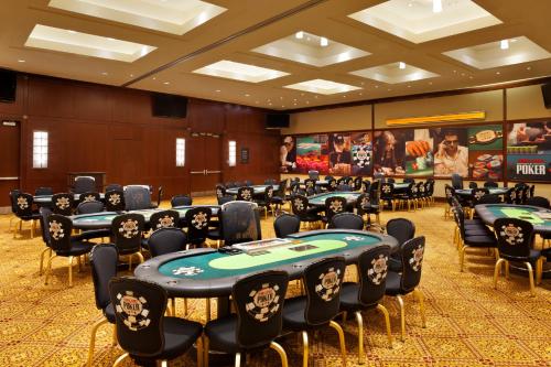a room with poker tables and chairs in it at Caesars Windsor Hotel and Casino in Windsor