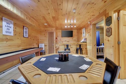 a dining room with a table in a cabin at Modern 6BR Cabin- Hot Tub Theater Basketball in White Haven