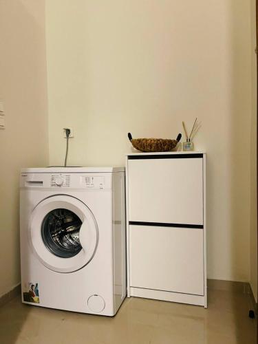 a washing machine with a bowl on top of it at Beauty Home Orestiada Center in Orestiada