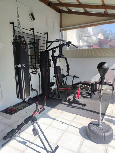 a room with a gym with several exercise bikes at Beauty Home Orestiada Center in Orestiada