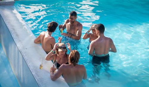 a group of people in a swimming pool at Dreamer Beach Club in San Andrés