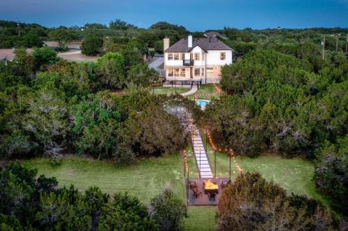 an aerial view of a house with a pool at Austin Spacious Haven - Pool Jacuzzi Firepit in Bee Cave