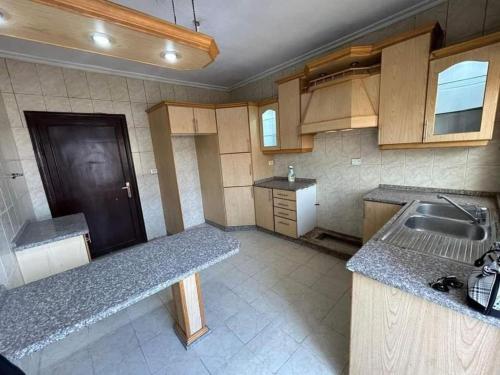 a kitchen with a sink and a counter top at ساكب هاوس in Sākib
