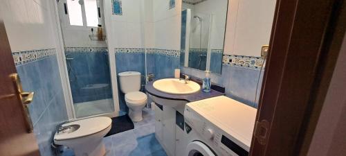 a bathroom with a sink and a toilet and a shower at Hansome flat in Ceuta