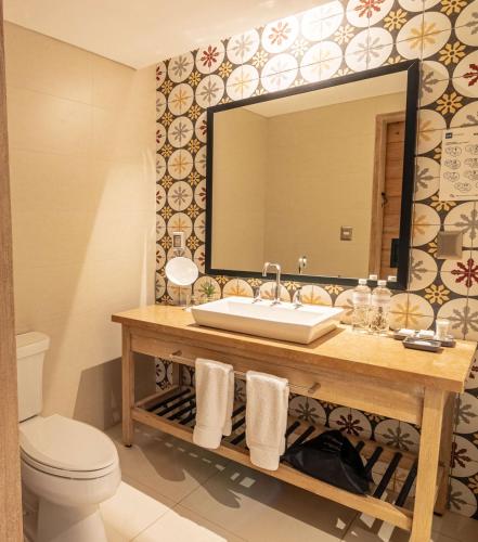 a bathroom with a sink and a mirror at Sonesta Posadas del Inca - Valle Sagrado Yucay Urubamba in Urubamba