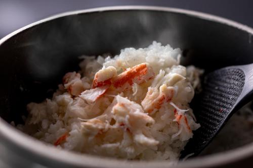 a bowl of rice with a spoon in it at シーサイド佐竹 in Kyotango