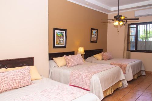 Ένα ή περισσότερα κρεβάτια σε δωμάτιο στο Hotel Hacienda Gualiqueme