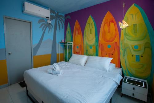 a bedroom with a bed with a surfboard wall at The Arts Smart Home Terengganu in Kuala Terengganu