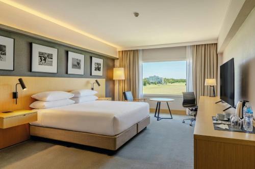 Ένα ή περισσότερα κρεβάτια σε δωμάτιο στο Sheraton Buenos Aires Greenville Polo & Resort