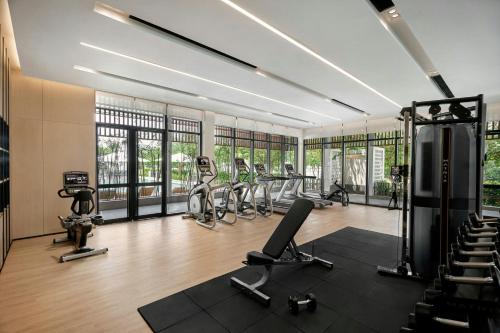 a gym with treadmills and ellipticals in a room at Fairfield by Marriott South Binh Duong in Thuan An
