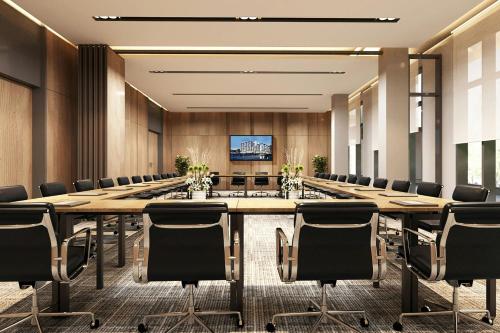 a large conference room with a long table and chairs at Fairfield by Marriott South Binh Duong in Thuan An