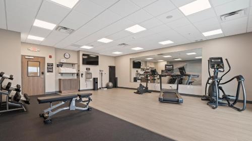 a gym with several exercise equipment in a room at Candlewood Suites Perry-National Fairground Area by IHG in Perry