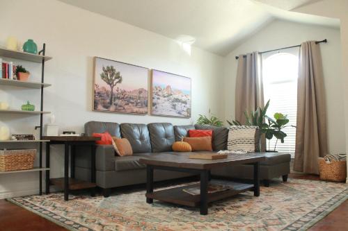 a living room with a couch and a table at Setting the right vibes. in Killeen
