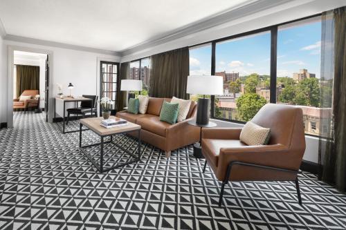 a living room with furniture and a view of a city at The Arcadian in Brookline