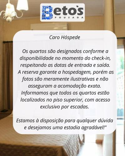 a sign that says ego hospice on a bed at Beto´s Pousada in Abraão