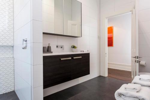 a bathroom with a sink and a mirror at Norwood Haven- Pool - Pet Friendly & Free WiFi in Norwood