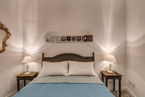 מיטה או מיטות בחדר ב-Loft in San Pietro