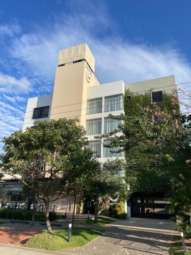 a building with a clock on the side of it at G Hotel by Gaya Group in Santa Cruz de la Sierra