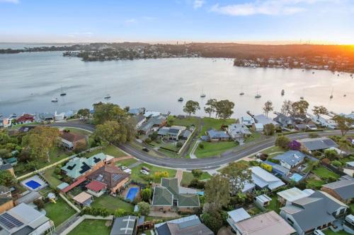 an aerial view of a suburb next to the water at Sealand Retreat in Fishing Point