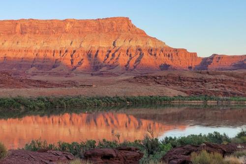 a view of a canyon with a body of water at Glamping Family Tent At Private Riverside Ranch in Moab