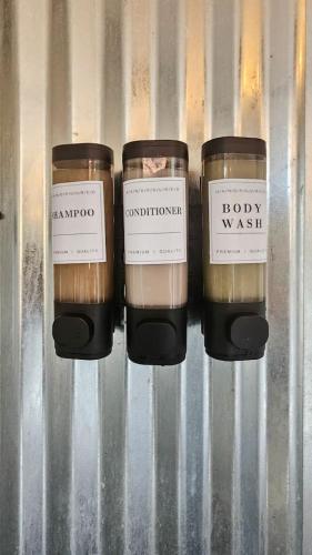 a group of three candles sitting on a shelf at Glamping Family Tent At Private Riverside Ranch in Moab