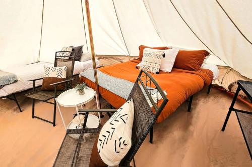 a room with a bed in a tent at Glamping Family Tent At Private Riverside Ranch in Moab