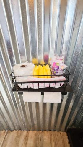 a plate of fruit on a shelf in a refrigerator at The Caves at Moab - At Private Riverside Ranch in Moab