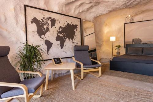 a room with a world map on the wall at The Caves at Moab - At Private Riverside Ranch in Moab