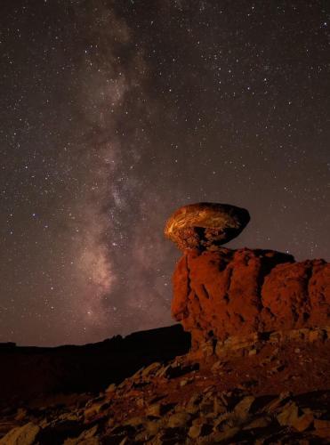 a starry night with the milky way in the sky at The Caves at Moab - At Private Riverside Ranch in Moab